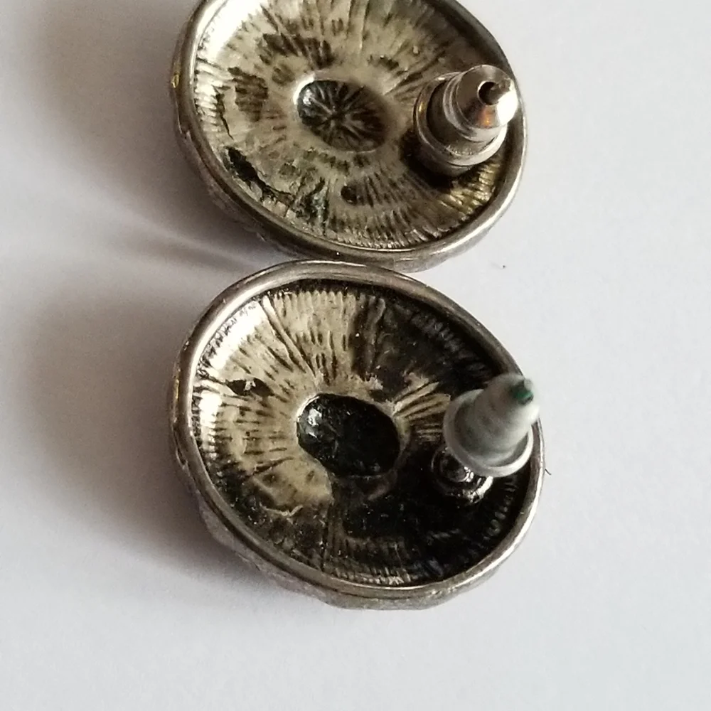 Earrings Silver tone earrings oval stud scrolled design